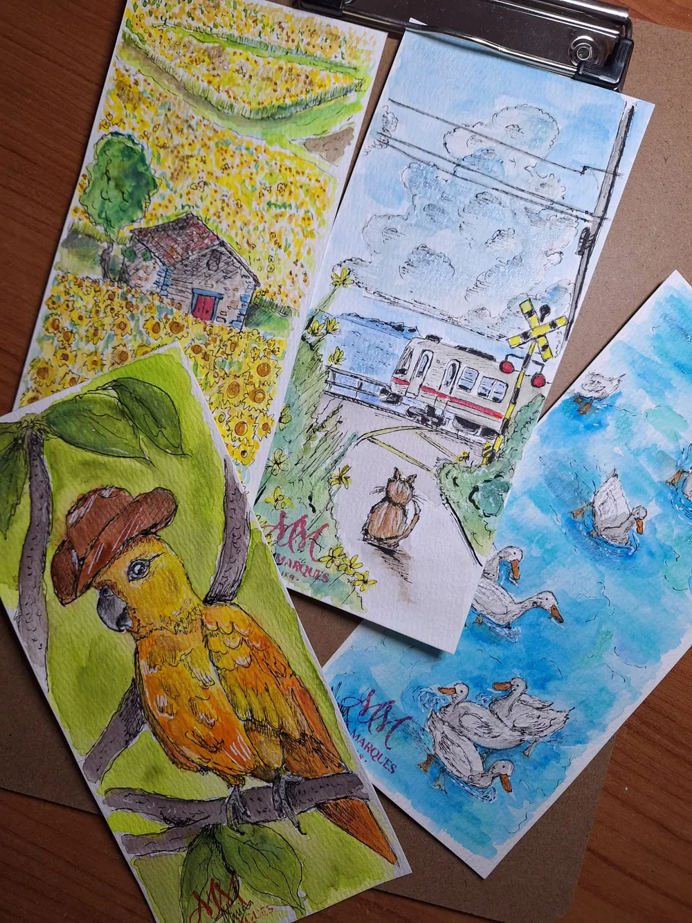 Quatro marcadores de livros pintados à mão